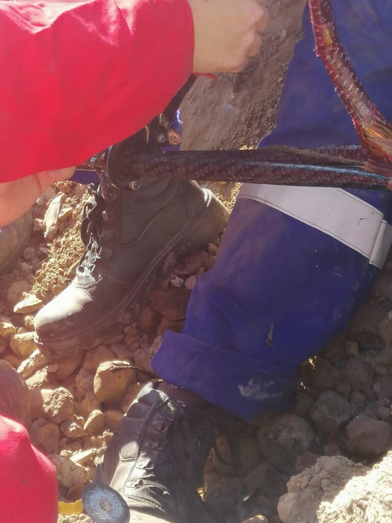 Jointing an underground supply cable in an open trench