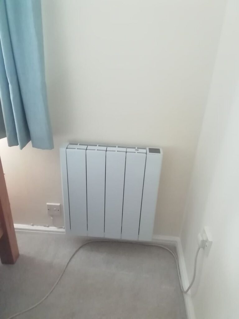 Compact ATC electric radiator installed in a Norwich bedroom