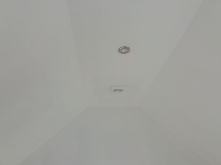 Downlight set into the sloped annexe ceiling