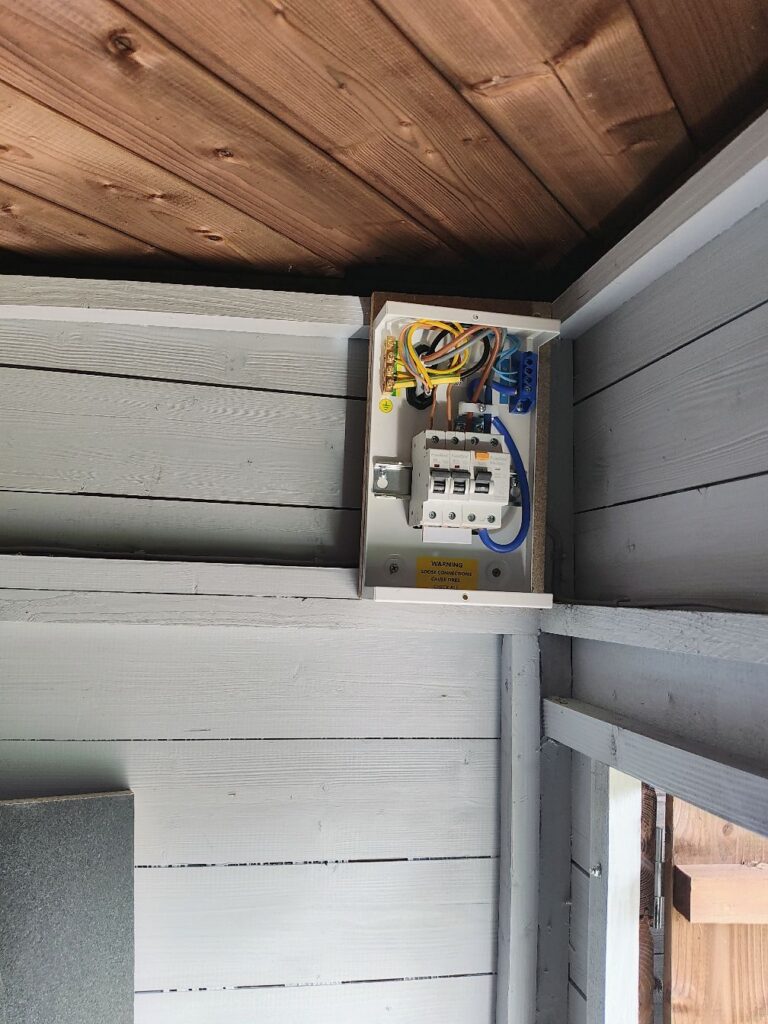 Small consumer unit with RCD protection serving a garden bar