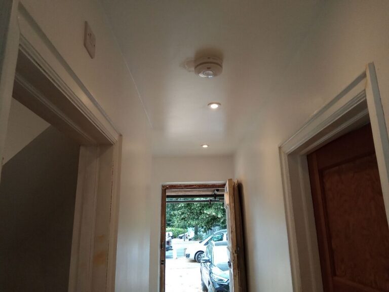Interlinked mains smoke alarm fitted in the hallway during a rewire