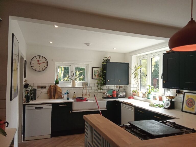 Pendant lighting over the island in a Hellesdon kitchen
