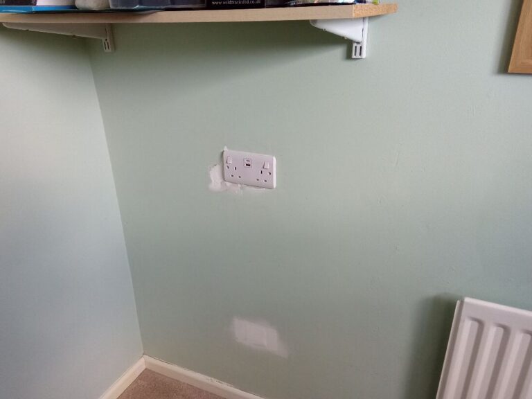 Socket and data outlet positioned for the media wall