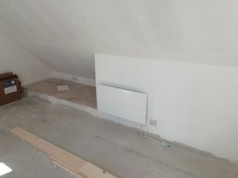 Wall-mounted electric panel heater installed in a Norwich annexe