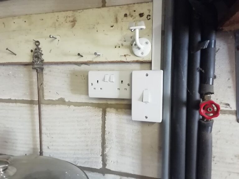 Double socket and switch fitted to blockwork in a Norwich annexe